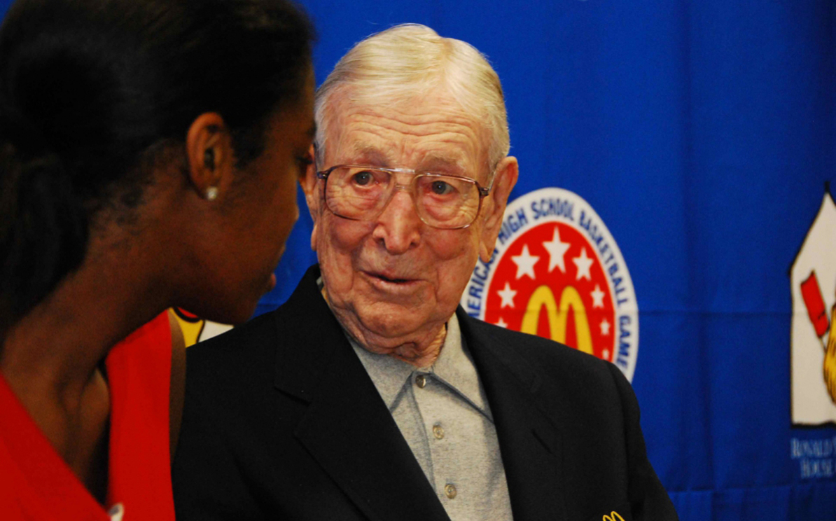 JW at mcd talking to black woman player